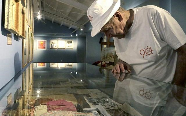 In this Thursday, Sept. 8, 2016 photo, Murray Greenfield, 90, looks around an exhibition about interned Jews at the Center of Visual Arts and Research in capital Nicosia, Cyprus. (AP Photo/Petros Karadjias) 