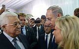 File: Prime Minister Benjamin Netanyahu and his wife Sara meet with Palestinian Authority President Mahmoud Abbas during the state funeral of late Israeli president Shimon Peres, at Mount Herzl in Jerusalem, September 30, 2016. (Amos Ben Gershom/GPO)