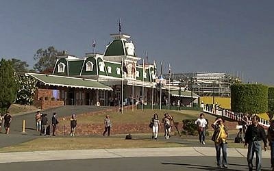Tourists walk outside Dreamworld in the Gold Coast, Australia, Tuesday, Oct. 25, 2016. (Screen capture: Australian Broadcasting Corporation via AP) 