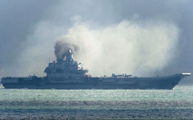 The Russian aircraft carrier Admiral Kuznetsov passes within a few miles of Dover, in the southeast of England as a fleet of Russian warships sail through the North Sea, and the English Channel Friday Oct. 21, 2016.(Gareth Fuller/PA Wire 