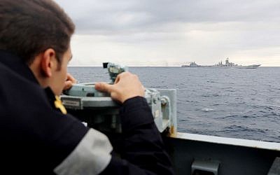 This  handout issued by Britain's Ministry of Defence and taken on Tuesday Oct 18, 2016 of a Royal Navy lookout onboard HMS Richmond, observing the  Russian  task group during its transit through the North Sea.  (PO(Phot) Dez Wade/MoD/Crown Copyright via AP)
