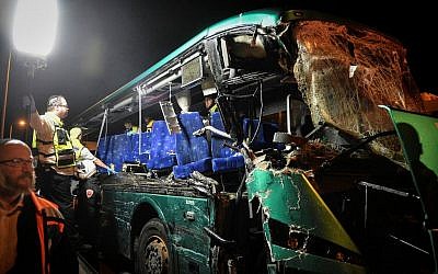 Medical and Rescue personnel evacuate wounded and dead passengers from the scene where a bus crashed into a truck pulled over on Route 1 near the Latrun interchange, on February 14, 2016. (Flash90) Medical and Rescue personnel evacuate wounded and dead passengers from the scene where a bus crashed into a truck pulled over on Route 1 near the Latrun interchange, on February 14, 2016. (Flash90)
