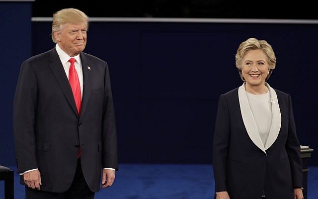 Republican presidential nominee Donald Trump stands next to Democratic presidential nominee Hillary Clinton during the second presidential debate at Washington University in St. Louis, Sunday, Oct. 9, 2016. (AP Photo/Julio Cortez)