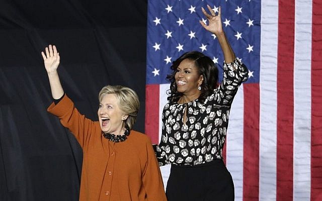 Democratic presidential candidate Hillary Clinton and first lady Michelle Obama wave to supporters during a campaign rally in Winston-Salem, North Carolina, Thursday, Oct. 27, 2016. (AP/Chuck Burton) Democratic presidential candidate Hillary Clinton and first lady Michelle Obama wave to supporters during a campaign rally in Winston-Salem, North Carolina, Thursday, Oct. 27, 2016. (AP/Chuck Burton)