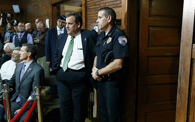 Gov. Chris Christie, R-New Jersey, waits for the arrival of Republican presidential candidate Donald Trump to a town hall, Thursday, Oct. 6, 2016, in Sandown, New Hampshire. (AP Photo/Evan Vucci)