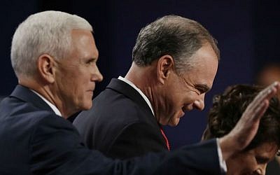 Democratic vice presidential nominee Sen. Tim Kaine leaves the stage with Republican vice-presidential nominee Gov. Mike Pence during the vice presidential debate at Longwood University in Farmville, Virginia, Tuesday, Oct. 4, 2016. (AP Photo/Patrick Semansky)