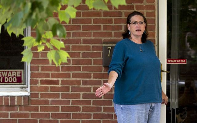 Debbie, the wife of NSA contractor Harold Thomas Martin III, talks to reporters outside of her home in Glen Burnie, Maryland, Wednesday, Oct. 5, 2016. (AP Photo/Jose Luis Magana)