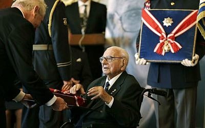 In this Tuesday, Oct. 28, 2014 file photo, Czech Republic President Milos Zeman decorates Nicholas Winton, center, with the country's highest decoration, The Order of the White Lion, in Prague, Czech Republic. (AP Photo/Petr David Josek, File)