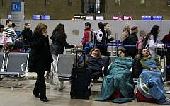 Passengers sleep at Ben Gurion International Airport, on March 19, 2008. (Anna Kaplan/ Flash90)