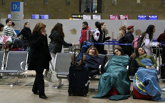 Passengers sleep at Ben Gurion International Airport, on March 19, 2008. (Anna Kaplan/ Flash90) Passengers sleep at Ben Gurion International Airport, on March 19, 2008. (Anna Kaplan/ Flash90)