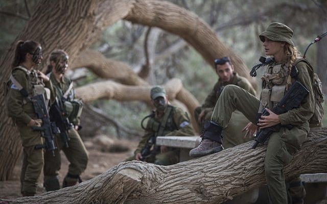 Soldiers of the Caracal Battalion rest before a hike as part of their training on September 3, 2014. (Hadas Parush/Flash90) Soldiers of the Caracal Battalion rest before a hike as part of their training on September 3, 2014. (Hadas Parush/Flash90)