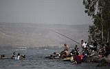 Israelis enjoy the beaches of the Sea of Galilee in Northern Israel, during the Jewish holiday of Passover, on April 26, 2016. (Hadas Parush/Flash90)
