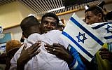 Ethiopian families are reunited on October 9, 2016, as the first group of Ethiopian immigrants arrives at Ben Gurion airport since the government announced the "end" of Ethiopian aliyah in August 2013. (Miriam Alster/Flash90)