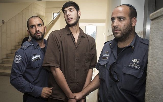 Muhammad Fuaz Ibrahim Julani, 22, from the Shuafat refugee camp in East Jerusalem is taken into the Jerusalem District Court for his indictment after being arrested for planning a large-scale terror attack in the city, on October 11, 2016. (Hadas Parush/Flash90)