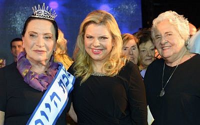 Sara Netanyahu (center) with the winner of a beauty pageant for Holocaust survivors, Anna Grinis, in Haifa on October 30, 2016. (Amos Ben Gershom/GPO)