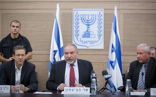 Defense Minister Avigdor Liberman addresses the Foreign Affairs and Defense Committee, flanked by Opposition Leader Isaac Herzog, left and the committee's chairperson Avi Dichter, right, in the Knesset, on October 31, 2016. (Miriam Alster/Flash90) Defense Minister Avigdor Liberman addresses the Foreign Affairs and Defense Committee, flanked by Opposition Leader Isaac Herzog, left and the committee's chairperson Avi Dichter, right, in the Knesset, on October 31, 2016. (Miriam Alster/Flash90)