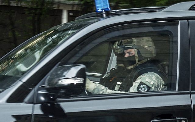 A police car leaves the district court in Dresden, eastern Germany, October 10, 2016. (AP Photo/Jens Meyer)