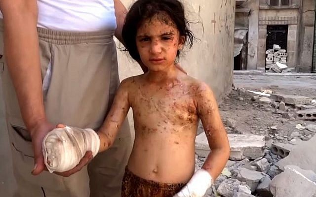 Six-year-old Amina in Aleppo blames Bashar Assad for killing her brothers (Screen capture: YouTube) Six-year-old Amina in Aleppo blames Bashar Assad for killing her brothers (Screen capture: YouTube)