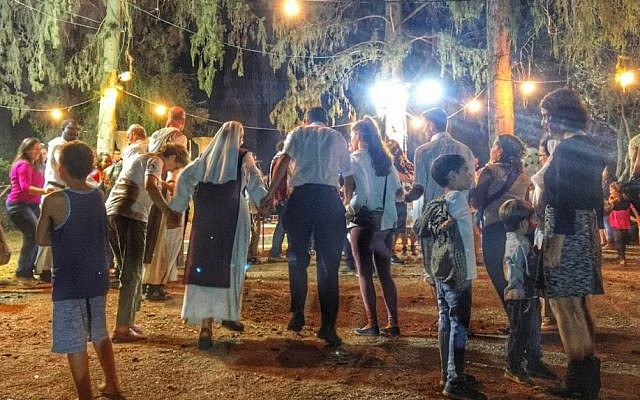 Revellers celebrate Simhat Torah at the Birkat Shalom synagogue in Kibbutz Gezer, October 23, 2016 (Sarah Tuttle-Singer)