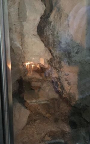 A view into the Jesus tomb through a newly created window, Church of the Holy Sepulchre, Jerusalem, October 30, 2106 (Sarah Tuttle-Singer / ToI staff)
