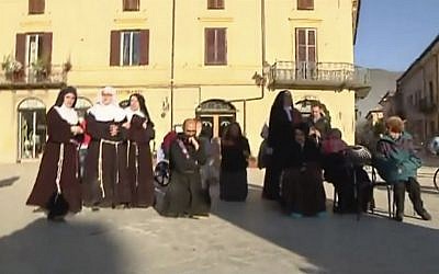 Priests and nuns flee their church in Norcia, Italy on October 30, 2016, after a powerful earthquake with a preliminary magnitude of 6.6 rocked central and southern Italy. (Screenshot, Sky Italia via AP)