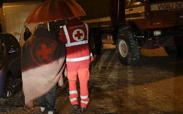 Residents are assisted by the Italian red Cross after a 5.9 earthquake destroyed part of their neighborhood in the small town of Visso, central Italy, October 27, 2016. (AP/Alessandra Tarantino) 