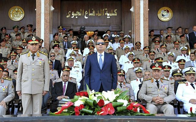 In this July 22, 2015, file photo, provided by the office of the Egyptian Presidency, Egyptian President Abdel-Fattah el-Sissi, center, and Defense Minister Sedqi Sobh, left, stand at attention at the Air Defense Academy in Alexandria, Egypt. (Mohammed Samaha/Egyptian Presidency via AP, File) In this July 22, 2015, file photo, provided by the office of the Egyptian Presidency, Egyptian President Abdel-Fattah el-Sissi, center, and Defense Minister Sedqi Sobh, left, stand at attention at the Air Defense Academy in Alexandria, Egypt. (Mohammed Samaha/Egyptian Presidency via AP, File)