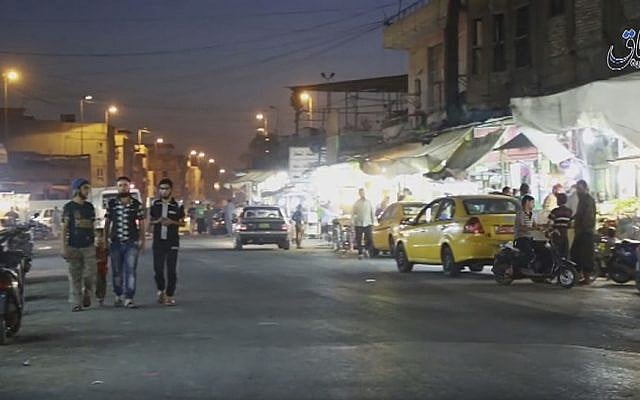 A street scene from a video published by the Islamic State group showing a street in Mosul, Iraq, October 17, 2016. (Militant video, Amaq News Agency via AP) A street scene from a video published by the Islamic State group showing a street in Mosul, Iraq, October 17, 2016. (Militant video, Amaq News Agency via AP)