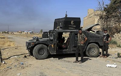Iraq's elite counterterrorism forces are deployed in the town of Bartella, Iraq, Saturday, Oct. 22, 2016. (Khalid Mohammed)