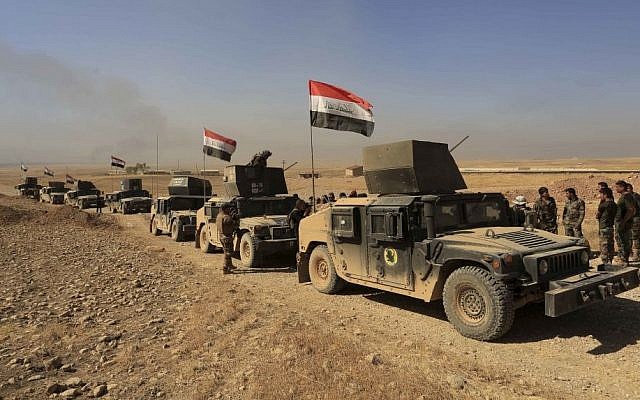 Iraq's elite counter-terrorism forces patrol outside the town of Bartella, Iraq, Saturday, October 22, 2016. (Khalid Mohammed/AP) Iraq's elite counter-terrorism forces patrol outside the town of Bartella, Iraq, Saturday, October 22, 2016. (Khalid Mohammed/AP)