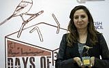 In this Thursday Oct. 20, 2016 photo, Palestinian producer May Odeh holds the Sunbird Short Film Award trophy for the film entitled 'Izriqaq (Blued),' during the Days of Cinema awards ceremony, in the West Bank city of Ramallah. (Nasser Nasser/AP)