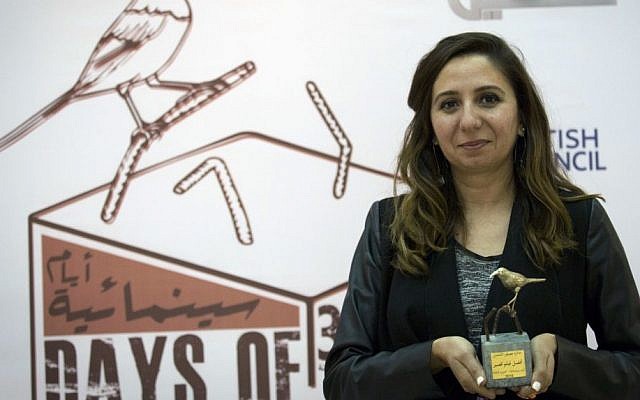 In this Thursday Oct. 20, 2016 photo, Palestinian producer May Odeh holds the Sunbird Short Film Award trophy for the film entitled 'Izriqaq (Blued),' during the Days of Cinema awards ceremony, in the West Bank city of Ramallah. (Nasser Nasser/AP) In this Thursday Oct. 20, 2016 photo, Palestinian producer May Odeh holds the Sunbird Short Film Award trophy for the film entitled 'Izriqaq (Blued),' during the Days of Cinema awards ceremony, in the West Bank city of Ramallah. (Nasser Nasser/AP)