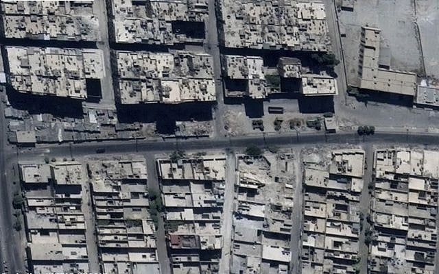 This satellite images released by the United Nations, shows the Sha'ar district of Aleppo, Syria, September 18, 2016, before it was bombed with strikes leaving craters in a road. (US Department of State, Humanitarian Information Unit, UNITAR-UNOSAT via AP)