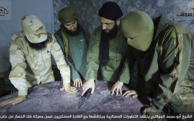 Abu Mohammed al-Golani (center), the leader of al-Qaeda-linked insurgent group Fatah al-Sham Front, is seen in this picture posted by the group discussing battlefield details with field commanders. (Militant UGC via AP) Abu Mohammed al-Golani (center), the leader of al-Qaeda-linked insurgent group Fatah al-Sham Front, is seen in this picture posted by the group discussing battlefield details with field commanders. (Militant UGC via AP)