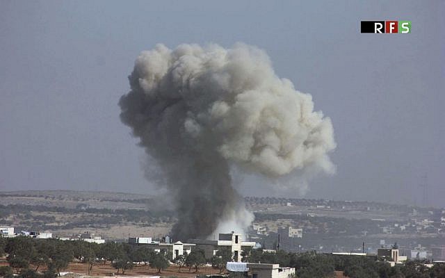 This photo provided by the Revolutionary Forces of Syria, an opposition activist media organization, shows an airstrike that killed over 20 people in the village of Hass, Syria, October 26, 2016. (Revolutionary Forces of Syria, via AP) This photo provided by the Revolutionary Forces of Syria, an opposition activist media organization, shows an airstrike that killed over 20 people in the village of Hass, Syria, October 26, 2016. (Revolutionary Forces of Syria, via AP)