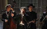 Illustrative: In this February 13, 2011, file photo, Bob Dylan, center, performs at the 53rd annual Grammy Awards in Los Angeles. (AP Photo/Matt Sayles, File)