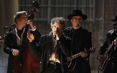 Illustrative: In this February 13, 2011, file photo, Bob Dylan, center, performs at the 53rd annual Grammy Awards in Los Angeles. (AP Photo/Matt Sayles, File)