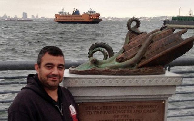 Artist Joseph Reginella poses for a photo, in the Staten Island borough of New York, with the cast bronze faux monument dedicated to the memory of the victims of the steam ferry Cornelius G. Kolff, on Sept. 29, 2016 (AP Photo/ Ula Ilnytzky ) Artist Joseph Reginella poses for a photo, in the Staten Island borough of New York, with the cast bronze faux monument dedicated to the memory of the victims of the steam ferry Cornelius G. Kolff, on Sept. 29, 2016 (AP Photo/ Ula Ilnytzky )