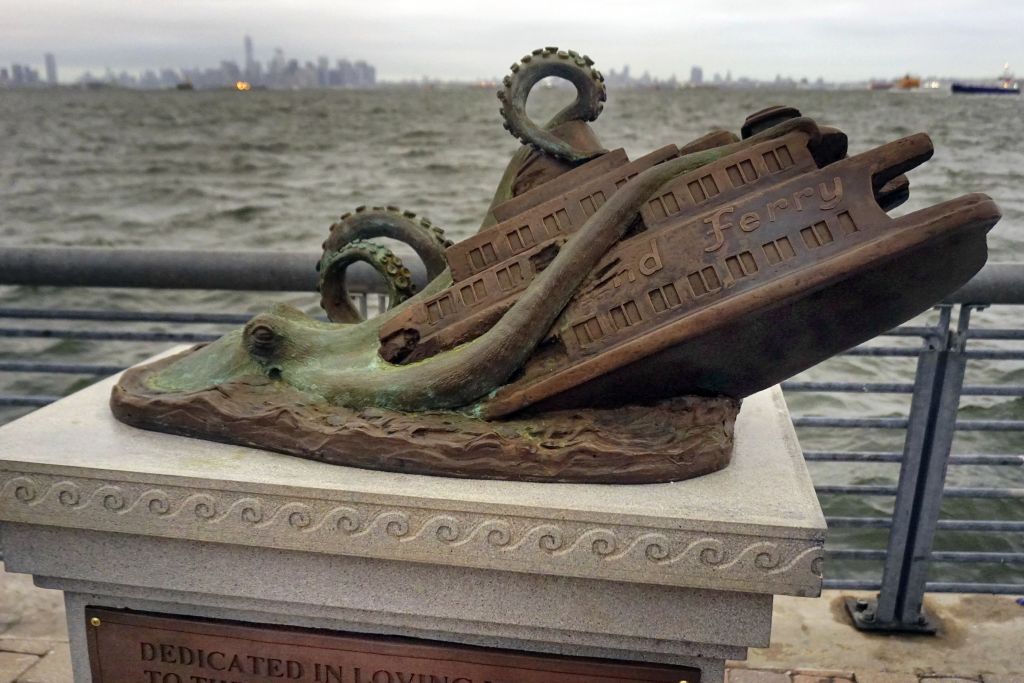 In this Sept. 29, 2016 photo, the cast bronze faux monument by artist Joseph Reginella, dedicated to the memory of the victims of the steam ferry Cornelius G. Kolff, is shown in the Staten Island borough of New York. (AP Photo/ Ula Ilnytzky ) In this Sept. 29, 2016 photo, the cast bronze faux monument by artist Joseph Reginella, dedicated to the memory of the victims of the steam ferry Cornelius G. Kolff, is shown in the Staten Island borough of New York. (AP Photo/ Ula Ilnytzky )