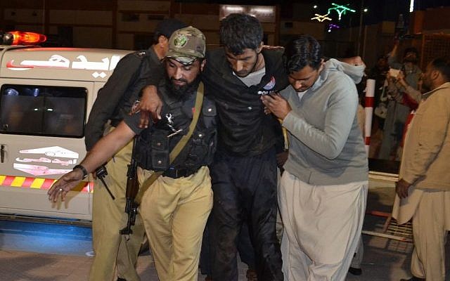 A Pakistani volunteer and a police officer rush an injured person to a hospital in Quetta, Pakistan, Monday, Oct. 24, 2016, after two separate attacks in Pakistan. (AP/Arshad Butt) A Pakistani volunteer and a police officer rush an injured person to a hospital in Quetta, Pakistan, Monday, Oct. 24, 2016, after two separate attacks in Pakistan. (AP/Arshad Butt)