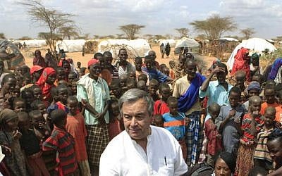 UN High Commissioner for Refugees Antonio Guterres is surrounded by Somali refugees as he speaks to the media in an area where recent arrivals from Somalia have settled, on the outskirts of Dagahaley Camp, outside Dadaab, Kenya, July 10, 2011. (AP Photo/Rebecca Blackwell, File)