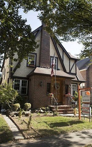 The exterior of a house in the Jamaica Estates neighborhood of the Queens borough of New York, where President Trump spent his early childhood, on October 18, 2016. (AP Photo/Mary Altaffer)
