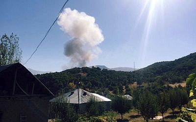 Illustrative: Smokes rise after alleged Kurdish militants detonated a car bomb outside a military station in Semdinli near the border with Iraq, Turkey, October, 9, 2016. (IHA via AP)