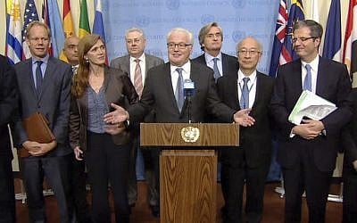 Russia's United Nations Ambassador Vitaly Churkin, center, makes an announcement that the UN Security Council unanimously agreed Wednesday, October 5, 2016, that Portugal's former prime minister Antonio Guterres should be the next secretary-general of the United Nations. (Screen Capture: United Nations Video via AP)