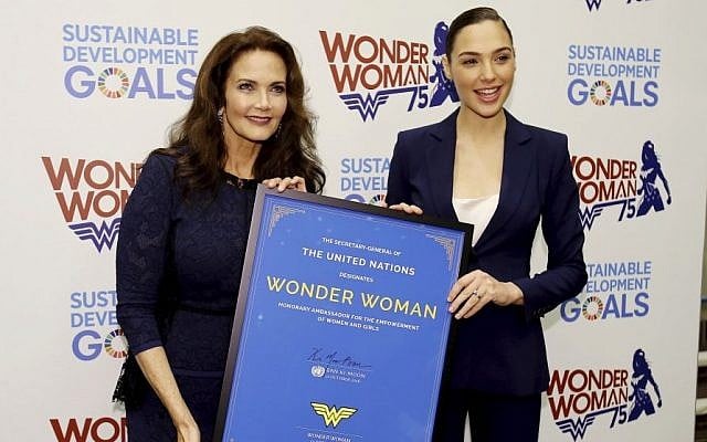 In this image released by Starpix, actress Lynda Carter, who starred in the 1970s series,"Wonder Woman," left, and actress Gal Gadot, who stars in the upcoming film, "Wonder Woman," appear at a United Nations event naming the super hero character as an Honorary Ambassador For the Empowerment of Women and girls, Friday, Oct. 21, 2016, at the United Nations. (Marion Curtis/Starpix/AP)