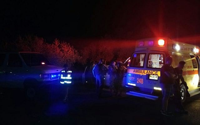 Paramedics at the site where a woman died on road in the West Bank after she and a man were attacked, October 23, 2016. (MDA spokesperson)