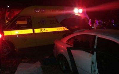 Paramedics at the site where a woman died on road in the West Bank after she and a man were attacked, October 23, 2016. (MDA spokesperson)