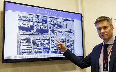 Einar Bjorgo, UNOSAT manager, shows a satellite image of a destroyed road of a district in Aleppo, which was taken on Sept. 26, 2016 during a press conference at the European headquarters of the United Nations in Geneva, Switzerland, Wednesday, Oct. 5, 2016. (Salvatore Di Nolfi/Keystone via AP) Einar Bjorgo, UNOSAT manager, shows a satellite image, taken on Sept. 26, 2016, of a destroyed road in a district in Aleppo, during a press conference at the European headquarters of the United Nations in Geneva, Switzerland, Wednesday, Oct. 5, 2016. (Salvatore Di Nolfi/Keystone via AP)