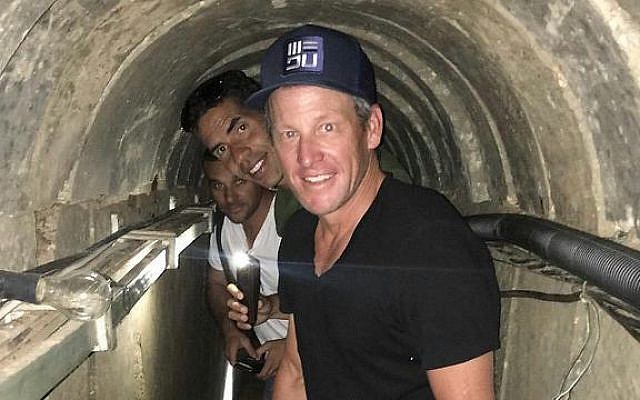 Lance Armstrong walks through a Hamas tunnel during a visit to Israel's Gaza border, October 2016 (Or Movement) Lance Armstrong walks through a Hamas tunnel during a visit to Israel's Gaza border, October 2016 (Or Movement)