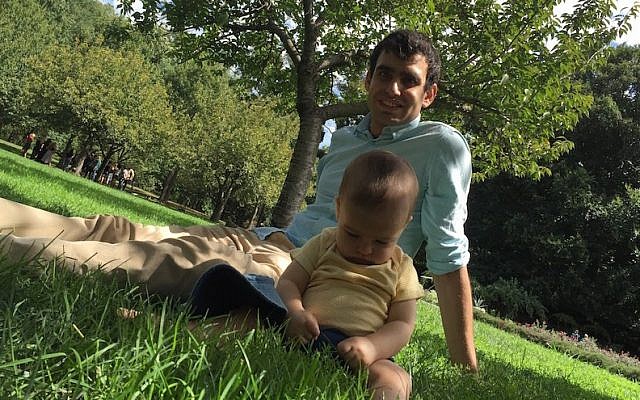 JTA staff writer Ben Sales and his son relaxing at the Brooklyn Botanic Garden in September 2016. (Courtesy of Sales)